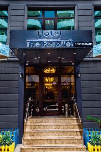 a hotel entrance with stairs in front of it at Parallel Hotel in Baku