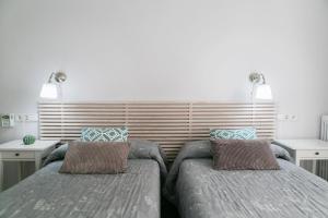 Posteľ alebo postele v izbe v ubytovaní Blanc Guest House