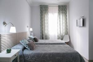 Posteľ alebo postele v izbe v ubytovaní Blanc Guest House