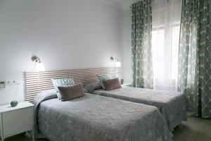 Posteľ alebo postele v izbe v ubytovaní Blanc Guest House