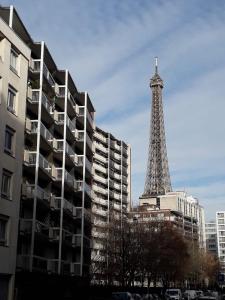 a view of the eiffel tower in a city at Joie Paris TOUR EIFFEL in Paris