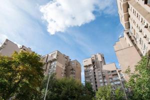 a group of tall buildings in a city at Hotel Service Predslava on Antonovicha street in Kyiv