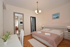 Posteľ alebo postele v izbe v ubytovaní Guesthouse Kamen Kuća