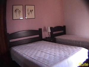 
A bed or beds in a room at Hotel Fazenda Portal da Canastra
