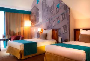 Posteľ alebo postele v izbe v ubytovaní Hotel Hanza