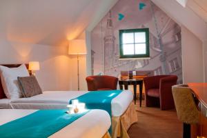 Posteľ alebo postele v izbe v ubytovaní Hotel Hanza