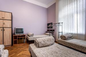 Postel nebo postele na pokoji v ubytování Centrum Hostel