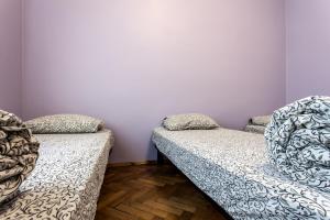 Postel nebo postele na pokoji v ubytování Centrum Hostel