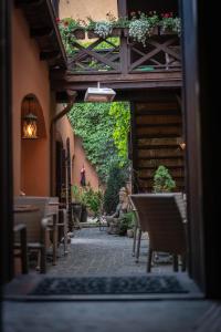 a view of a patio with chairs and plants at Mai Ram Yoga House in Vilnius