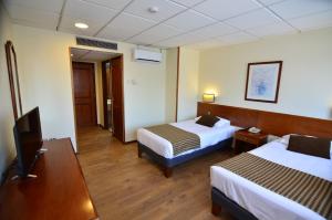 Postel nebo postele na pokoji v ubytování Tur Hotel Santiago + 29 fotografií