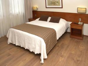 Letto o letti in una camera di Tur Hotel Santiago