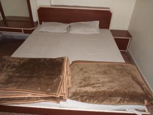 Кровать или кровати в номере Vijay Palace