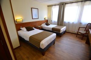 Letto o letti in una camera di Tur Hotel Santiago