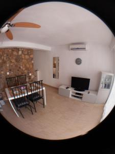 Televízia a/alebo spoločenská miestnosť v ubytovaní Fantástico Apartamento 1ª Línea de Playa
