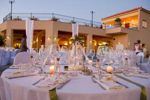 a table set up for a wedding with wine glasses at Varos Village Boutique Hotel in Város +37 photos