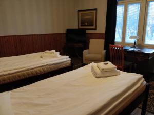 Кровать или кровати в номере Gasthaus Pooki