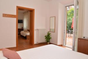 Postel nebo postele na pokoji v ubytování Hotel Quarcino + 37 fotografií
