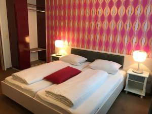 Кровать или кровати в номере Hotel Bruchwiese