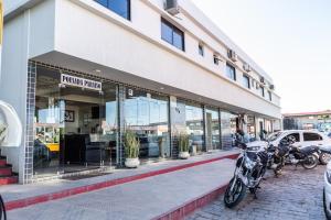 a store front with motorcycles parked outside of it at Pousada Paraiso in Guanambi