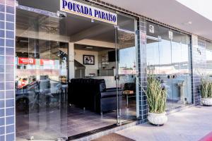 a store front with glass doors in a building at Pousada Paraiso in Guanambi