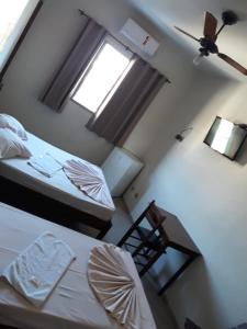 Rúm í herbergi á HOTEL LAREIRA