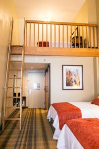 a bedroom with two beds and a loft at Amicalola Falls State Park and Lodge in Dawsonville