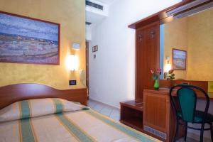 Posteľ alebo postele v izbe v ubytovaní Hotel Dorè
