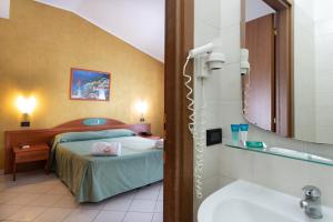 Posteľ alebo postele v izbe v ubytovaní Hotel Dorè