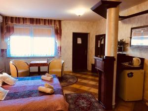 a bedroom with a bed with two pillows on it at Black Jack "OZONOWANY" in Będzin