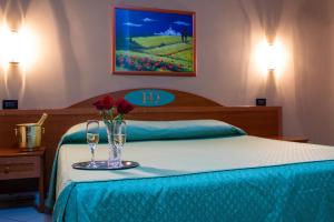 Posteľ alebo postele v izbe v ubytovaní Hotel Dorè