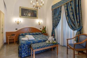 Кровать или кровати в номере Hotel Santa Prisca