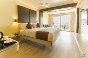 Darshan Hotel客房内的一张或多张床位