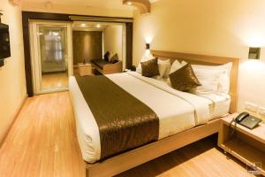 Darshan Hotel客房内的一张或多张床位