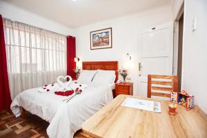 Postel nebo postele na pokoji v ubytování Hostal Danna Inn + 21 fotografií