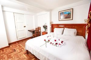 Кровать или кровати в номере Hostal Danna Inn