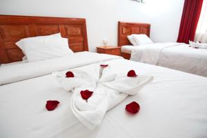Postel nebo postele na pokoji v ubytování Hostal Danna Inn