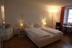 Postel nebo postele na pokoji v ubytování Hotel Bacchus Wine & Bites