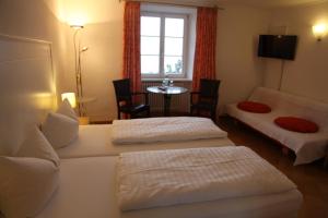 Postel nebo postele na pokoji v ubytování Hotel Bacchus Wine & Bites