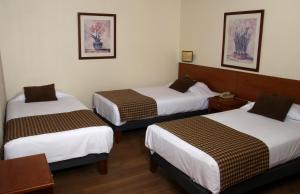 Letto o letti in una camera di Tur Hotel Santiago