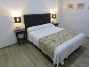 Postel nebo postele na pokoji v ubytování Living Sevilla Apartments Hércules