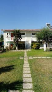 a stone path in front of a house at Diomare Villas in Kypseli +81 photos