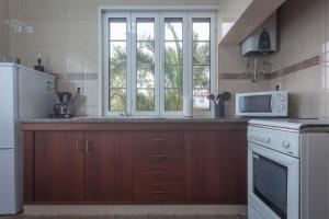 A cozinha ou cozinha compacta de Apartamentos em Casa da Avó Inês