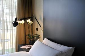 Tempat tidur dalam kamar di Evidencia Belverde Hotel