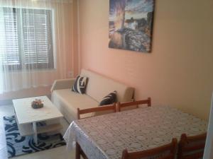 a living room with a couch and a table at Apartment Crikvenica 14 in Crikvenica