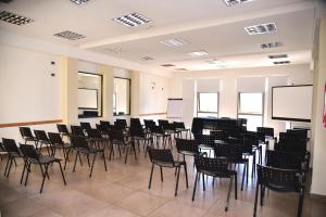 a large room with chairs and a podium in it at Hotel Confianza in Corrientes