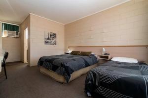 Postel nebo postele na pokoji v ubytování The Prince Mark Motel