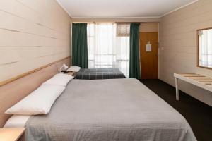 Postel nebo postele na pokoji v ubytování The Prince Mark Motel