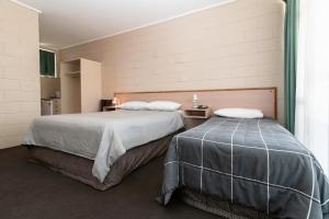 Postel nebo postele na pokoji v ubytování The Prince Mark Motel