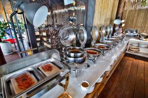 a buffet line of food in a restaurant at Phi Phi CoCo Beach Resort in Phi Phi Islands