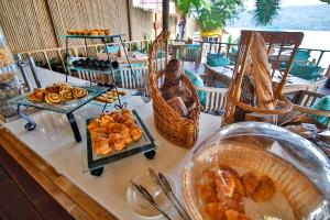 a buffet of food on a table at a restaurant at Phi Phi CoCo Beach Resort in Phi Phi Islands